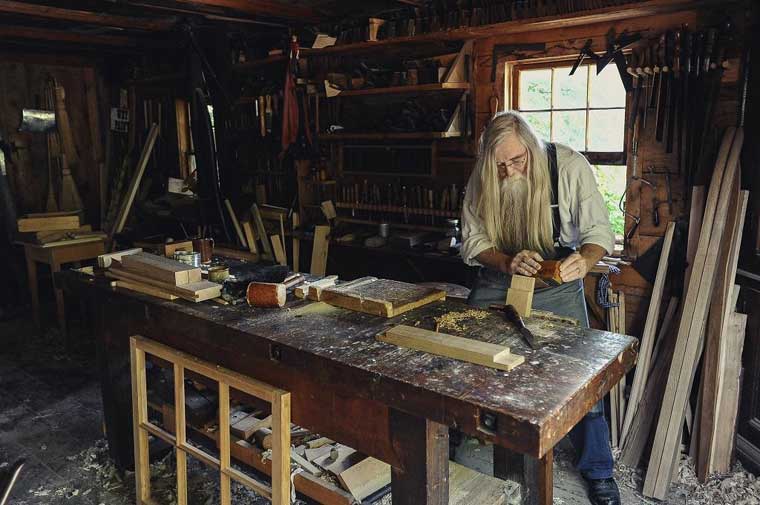 Old man doing woodworking